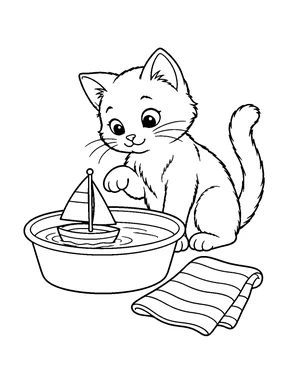 A cat watches a toy sailboat floating in a shallow basin beside a striped towel.